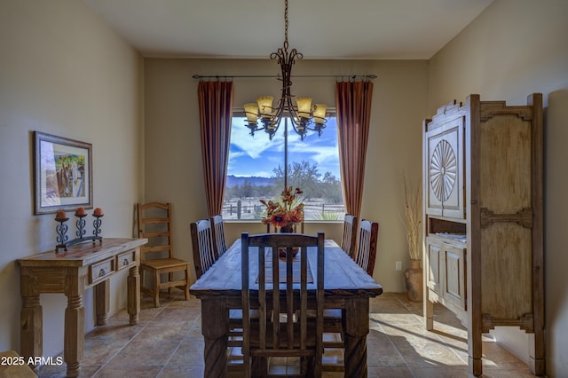 dining area featuring a notable chandelier