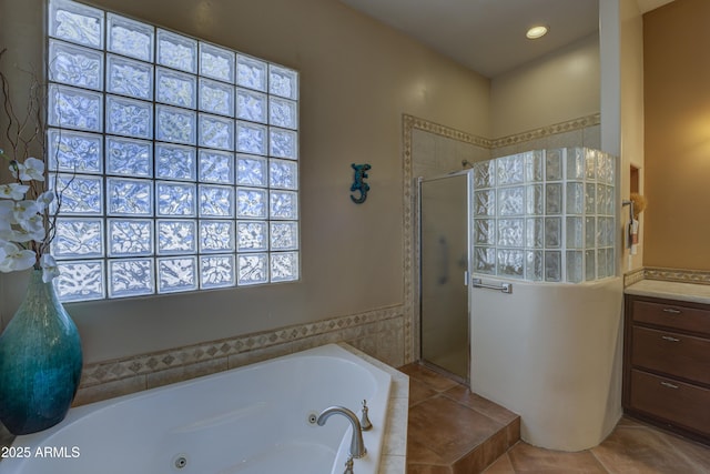 bathroom with tile patterned floors and separate shower and tub