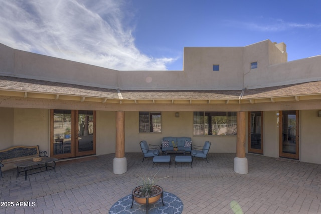 view of patio with outdoor lounge area and french doors