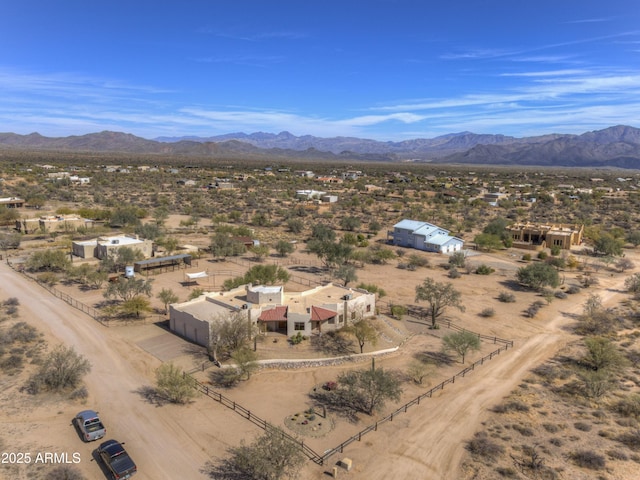 birds eye view of property with a mountain view