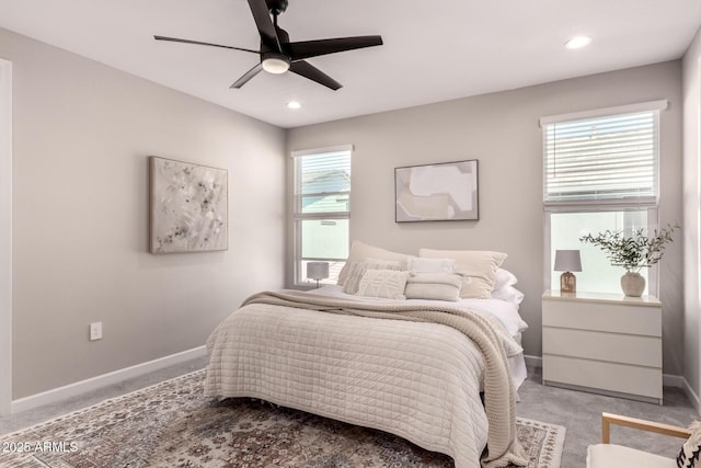 bedroom featuring light carpet, recessed lighting, a ceiling fan, and baseboards