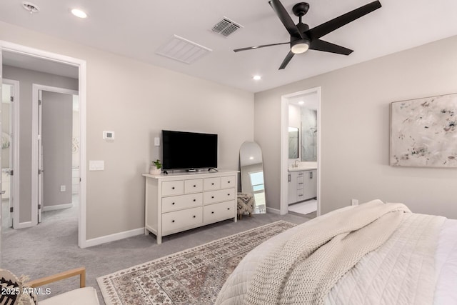 carpeted bedroom with recessed lighting, visible vents, baseboards, and ensuite bathroom