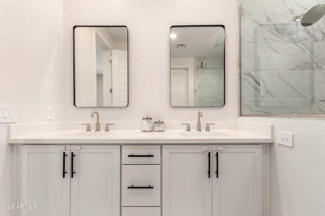 full bathroom featuring double vanity, a sink, and visible vents