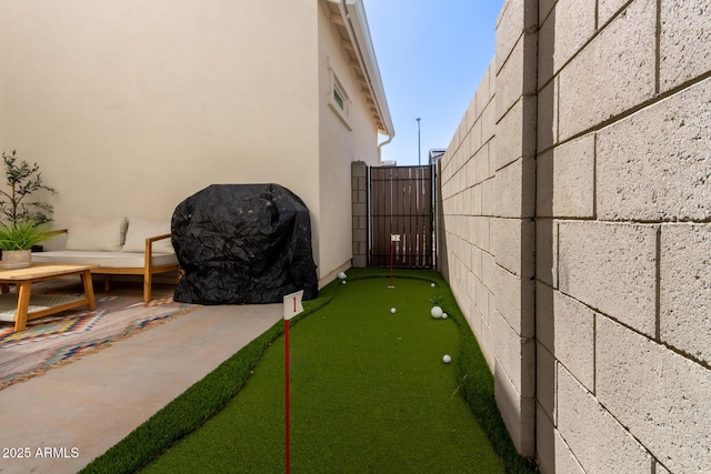 view of yard with a gate, a patio area, and fence