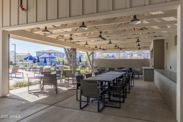 view of patio / terrace with ceiling fan and outdoor dining space