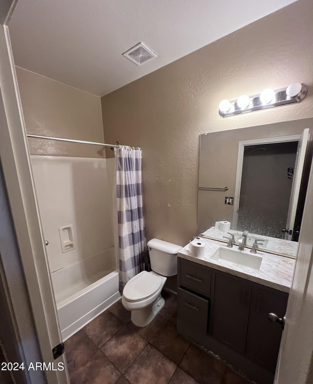 full bathroom featuring tile patterned flooring, vanity, shower / tub combo with curtain, and toilet