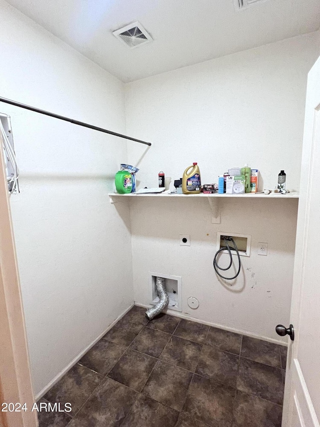 clothes washing area featuring hookup for a washing machine, gas dryer hookup, and electric dryer hookup