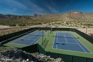 view of tennis court with a mountain view