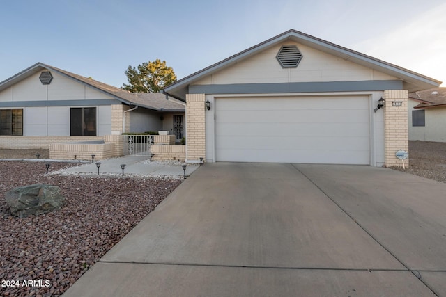 ranch-style home with a garage