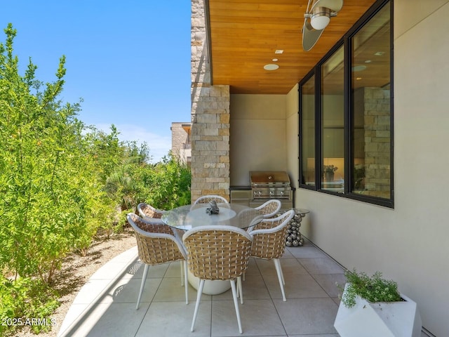 view of patio featuring area for grilling, an outdoor kitchen, and outdoor dining space