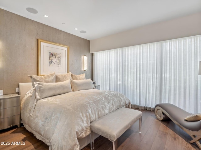 bedroom featuring wood finished floors and recessed lighting