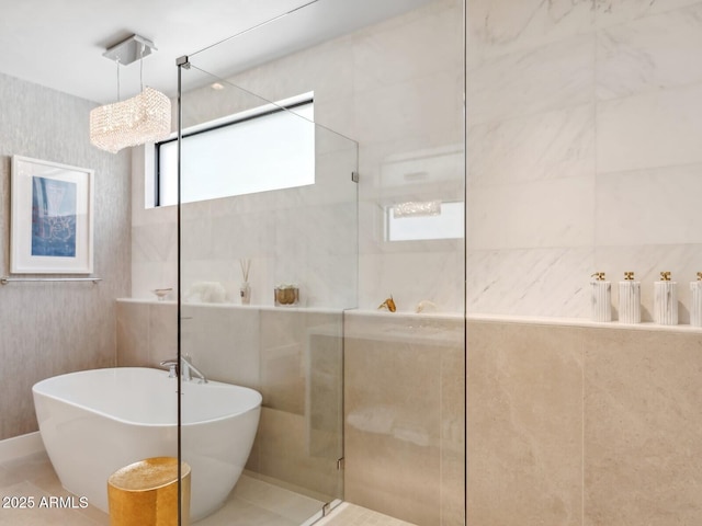 bathroom with walk in shower and a soaking tub