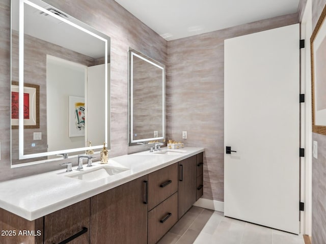 bathroom featuring tile patterned floors and double vanity