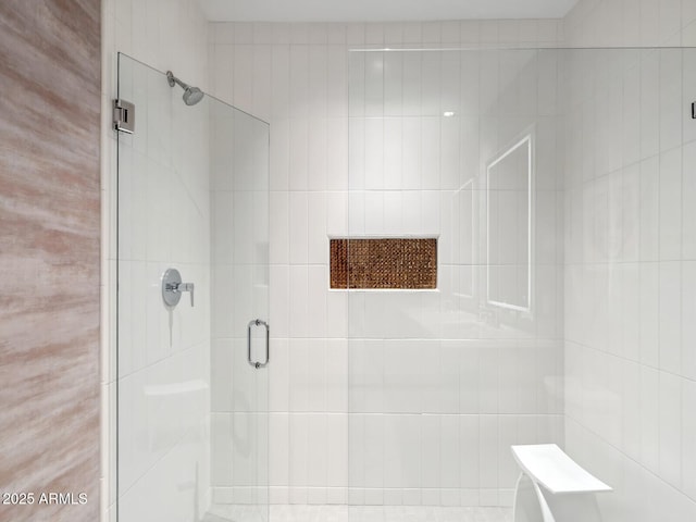 full bath with a shower stall