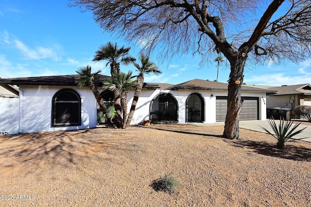 ranch-style home featuring a garage