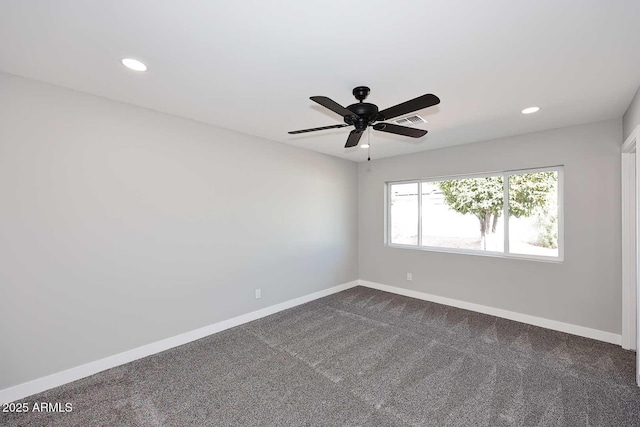 carpeted empty room featuring ceiling fan