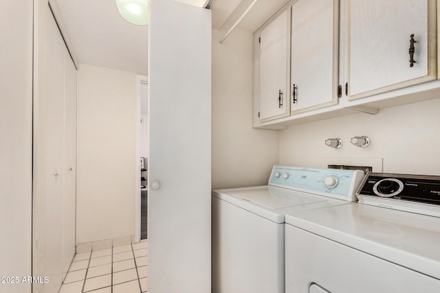 1012 E Wagon Wheel Dr, Phoenix, AZ 85020 - washroom featuring light tile patterned floors, washing machine and clothes dryer, and cabinet space