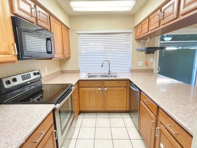 924 S Hacienda Dr Unit C, Tempe, AZ 85281 - kitchen with appliances with stainless steel finishes, a sink, light tile patterned flooring, and light countertops