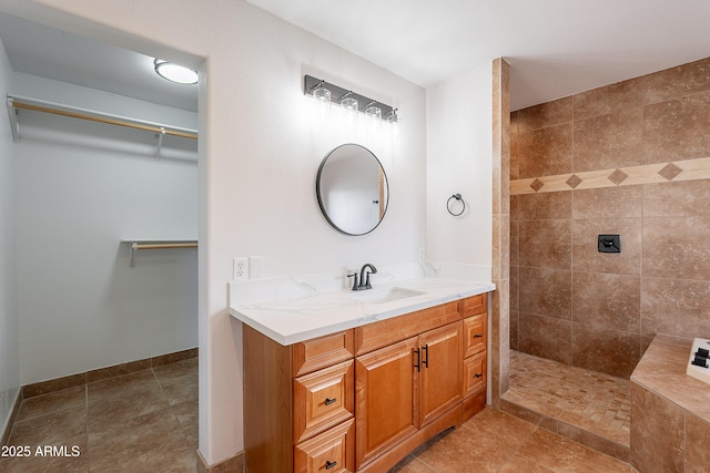 17207 E El Pueblo Blvd, Fountain Hills, AZ 85268 - bathroom featuring tiled shower, vanity, and a spacious closet