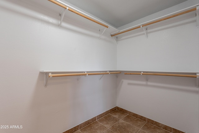 17207 E El Pueblo Blvd, Fountain Hills, AZ 85268 - spacious closet featuring dark tile patterned floors