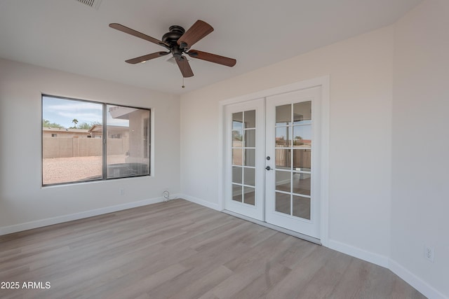 17207 E El Pueblo Blvd, Fountain Hills, AZ 85268 - unfurnished room with french doors, light wood-type flooring, ceiling fan, and baseboards