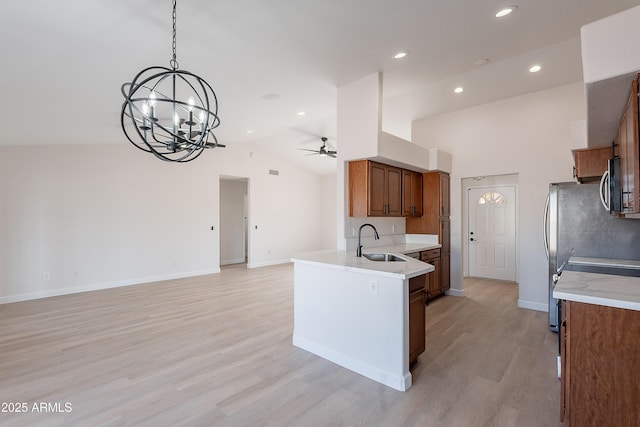 17207 E El Pueblo Blvd, Fountain Hills, AZ 85268 - kitchen with a sink, brown cabinets, stainless steel appliances, a chandelier, and ceiling fan