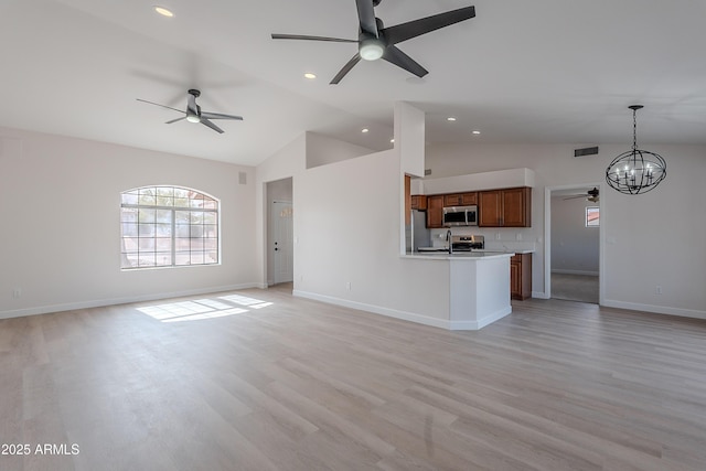 17207 E El Pueblo Blvd, Fountain Hills, AZ 85268 - unfurnished living room with a ceiling fan, vaulted ceiling, a chandelier, light wood-type flooring, and baseboards