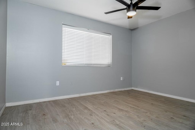 unfurnished room featuring ceiling fan and light wood-type flooring