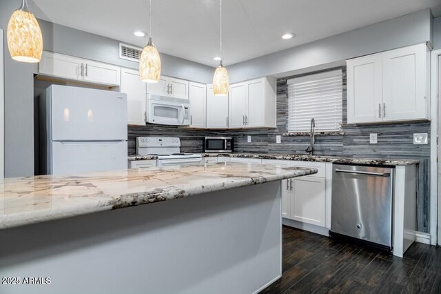 kitchen featuring white cabinetry, light stone counters, tasteful backsplash, decorative light fixtures, and stainless steel appliances