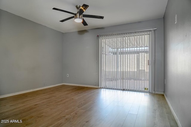 empty room featuring ceiling fan and light hardwood / wood-style flooring