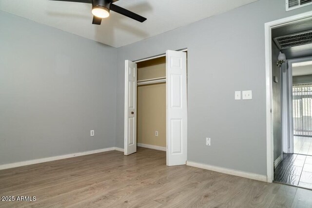 unfurnished bedroom featuring light hardwood / wood-style flooring and ceiling fan