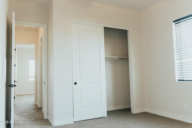 1623 E Hidalgo St, Apache Junction, AZ 85119 - unfurnished bedroom featuring light carpet and a closet