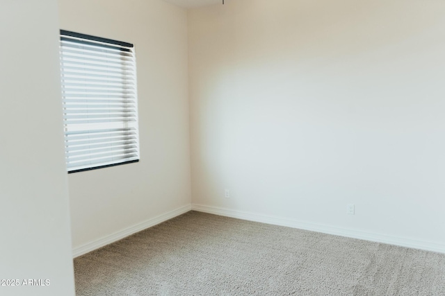 1623 E Hidalgo St, Apache Junction, AZ 85119 - carpeted empty room featuring baseboards