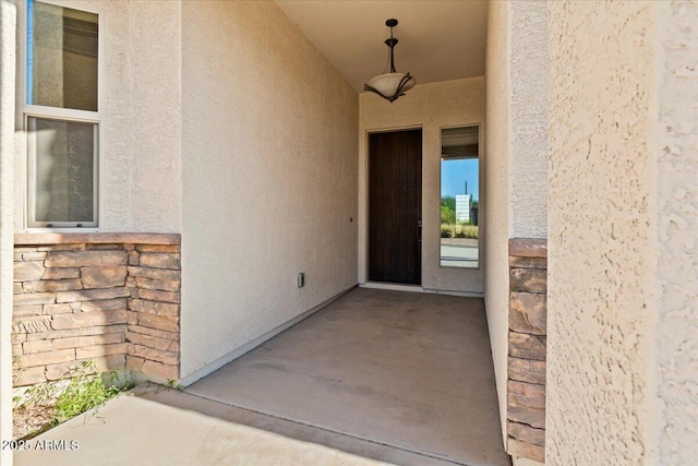 1623 E Hidalgo St, Apache Junction, AZ 85119 - view of exterior entry featuring stucco siding and stone siding