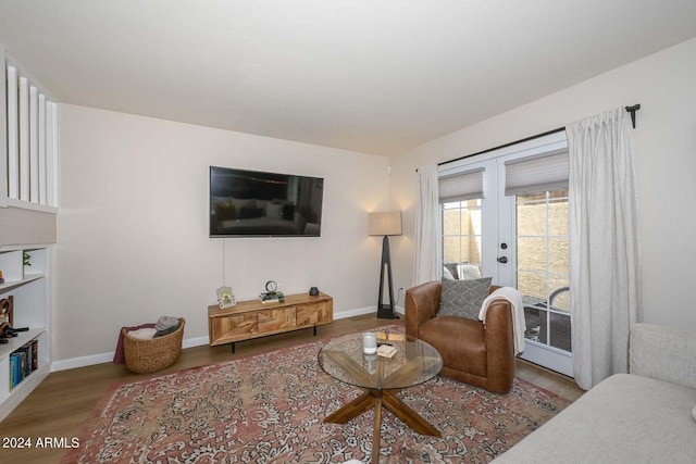 living room featuring hardwood / wood-style floors and french doors