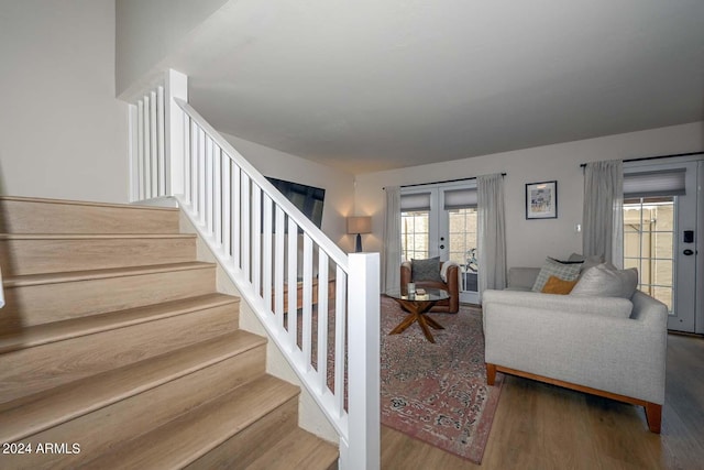 living room featuring french doors and dark hardwood / wood-style floors