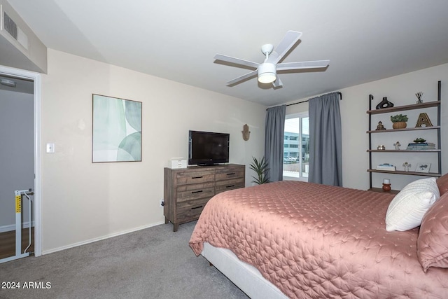 bedroom featuring ceiling fan and light carpet