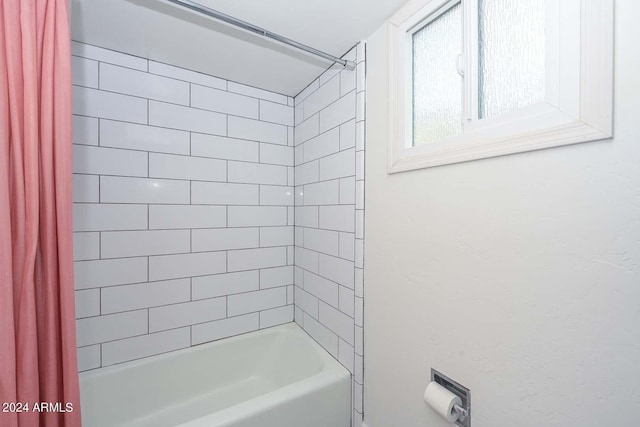 bathroom featuring shower / bathtub combination with curtain