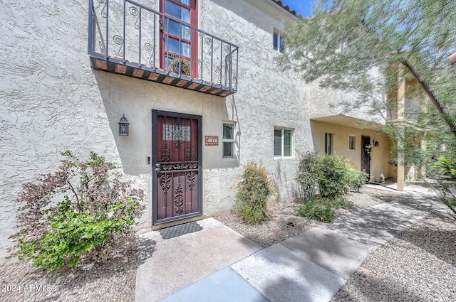 doorway to property with a balcony