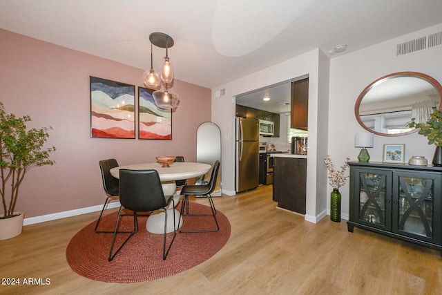 dining room with light hardwood / wood-style floors