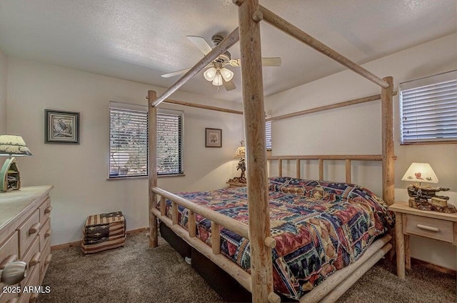 bedroom featuring ceiling fan, dark carpet, and a textured ceiling