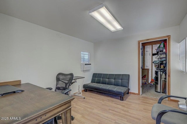 home office with light hardwood / wood-style floors