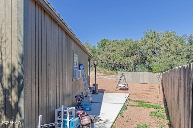 view of yard featuring cooling unit and a patio area