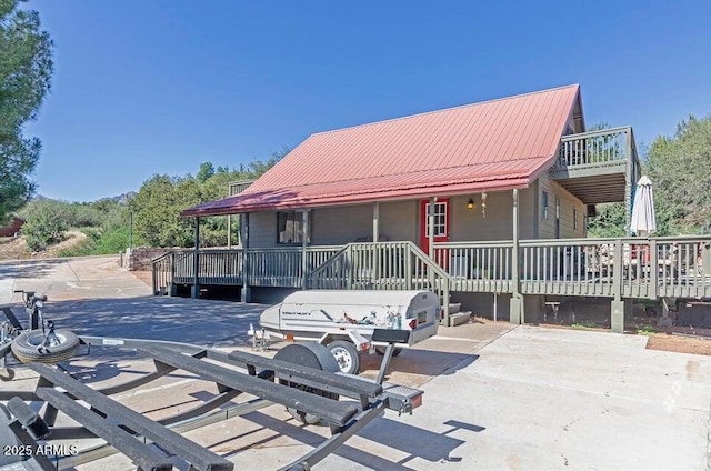 view of front of property with a wooden deck