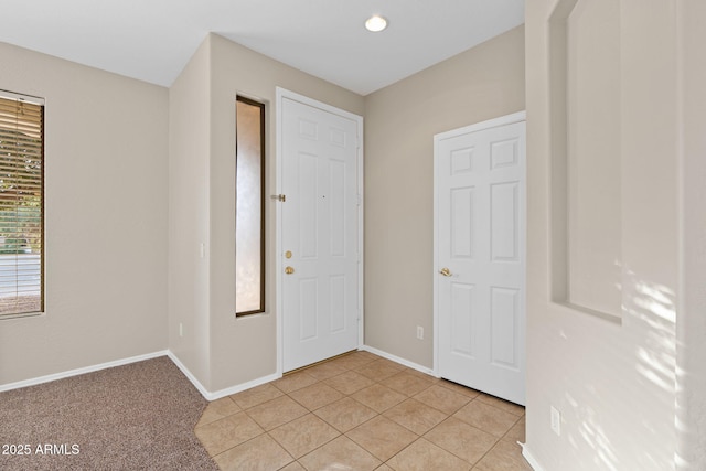 entryway featuring light tile patterned flooring