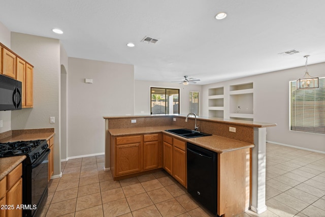 kitchen featuring built in features, light tile patterned floors, black appliances, and sink