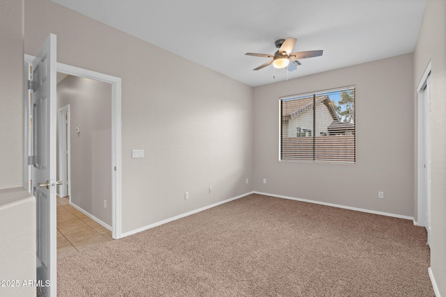 unfurnished bedroom featuring ceiling fan and light carpet