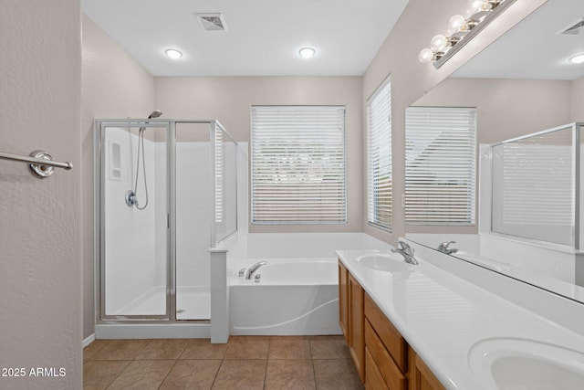 bathroom with vanity, tile patterned floors, and separate shower and tub