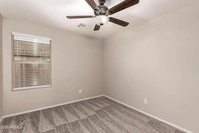 spare room with ceiling fan and carpet flooring