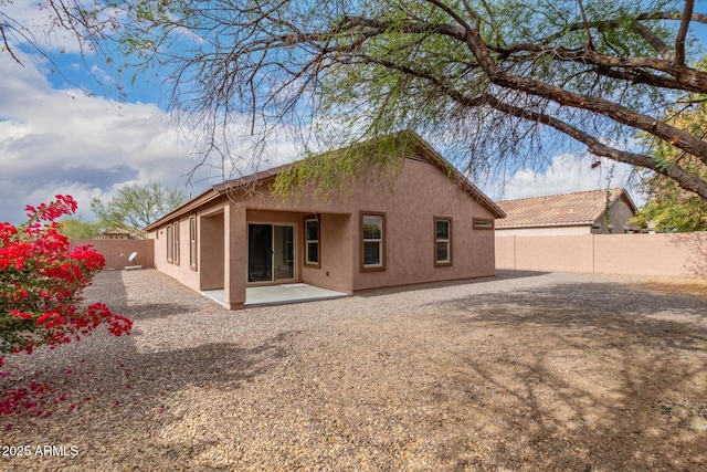 rear view of house with a patio